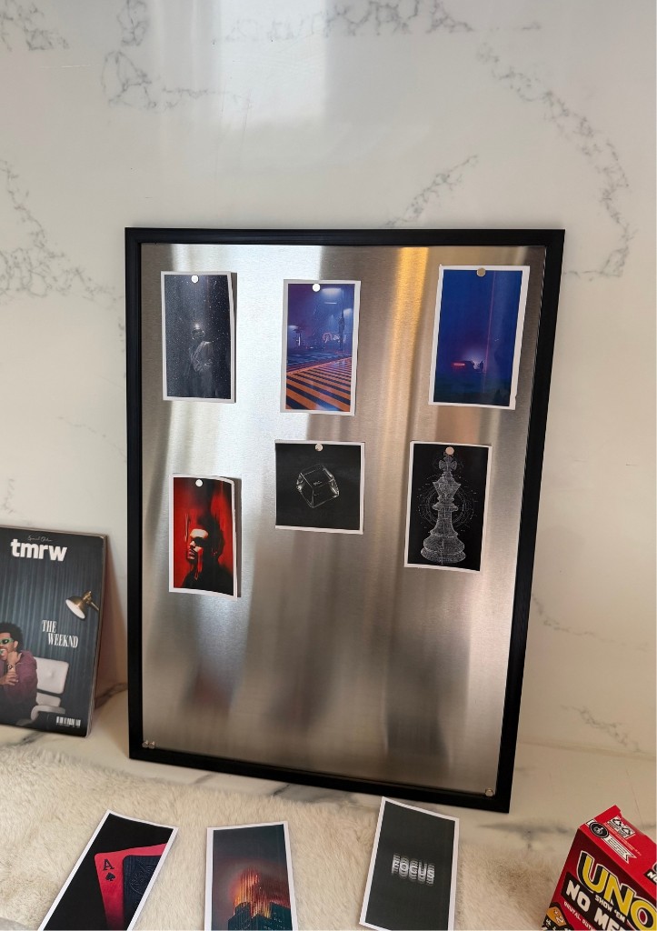 Metalli Magnetic Board with cards and keepsakes on a marble ledge